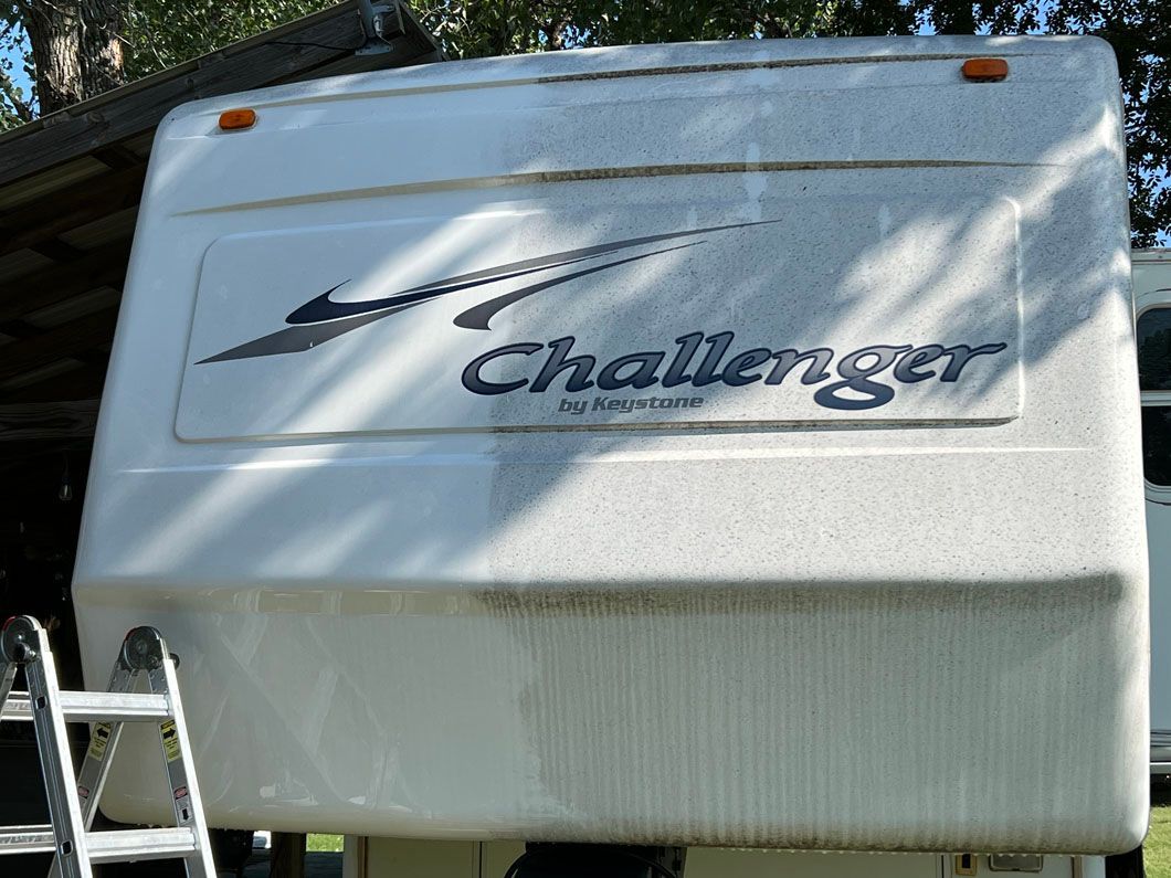 A white rv with the word challenger on it