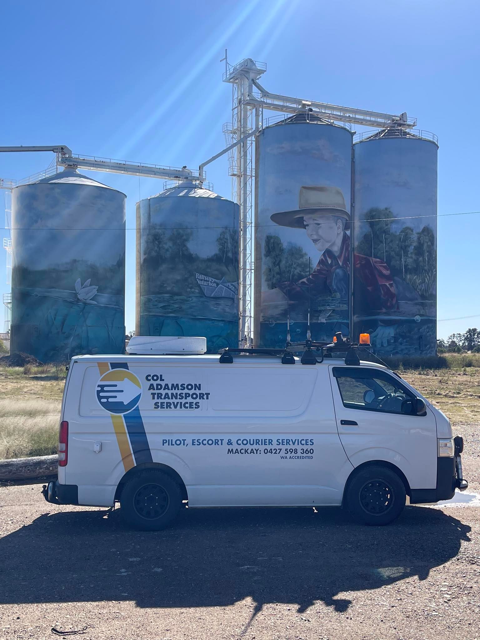 Truck Hauling Oversized Load on a Sunny Road; Suv in the Foreground — Col Adamson Transport Services in Farleigh, QLD