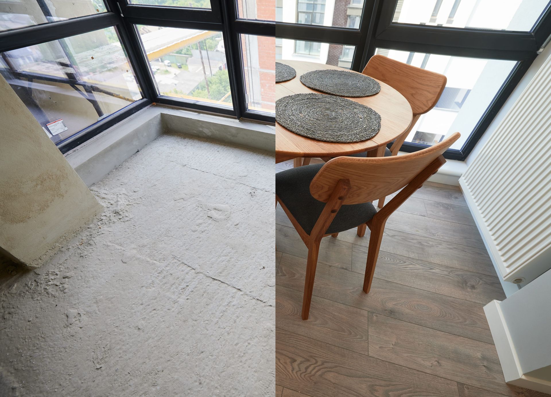 Small dining nook with two wooden chairs, round table, and large windows overlooking a balcony.