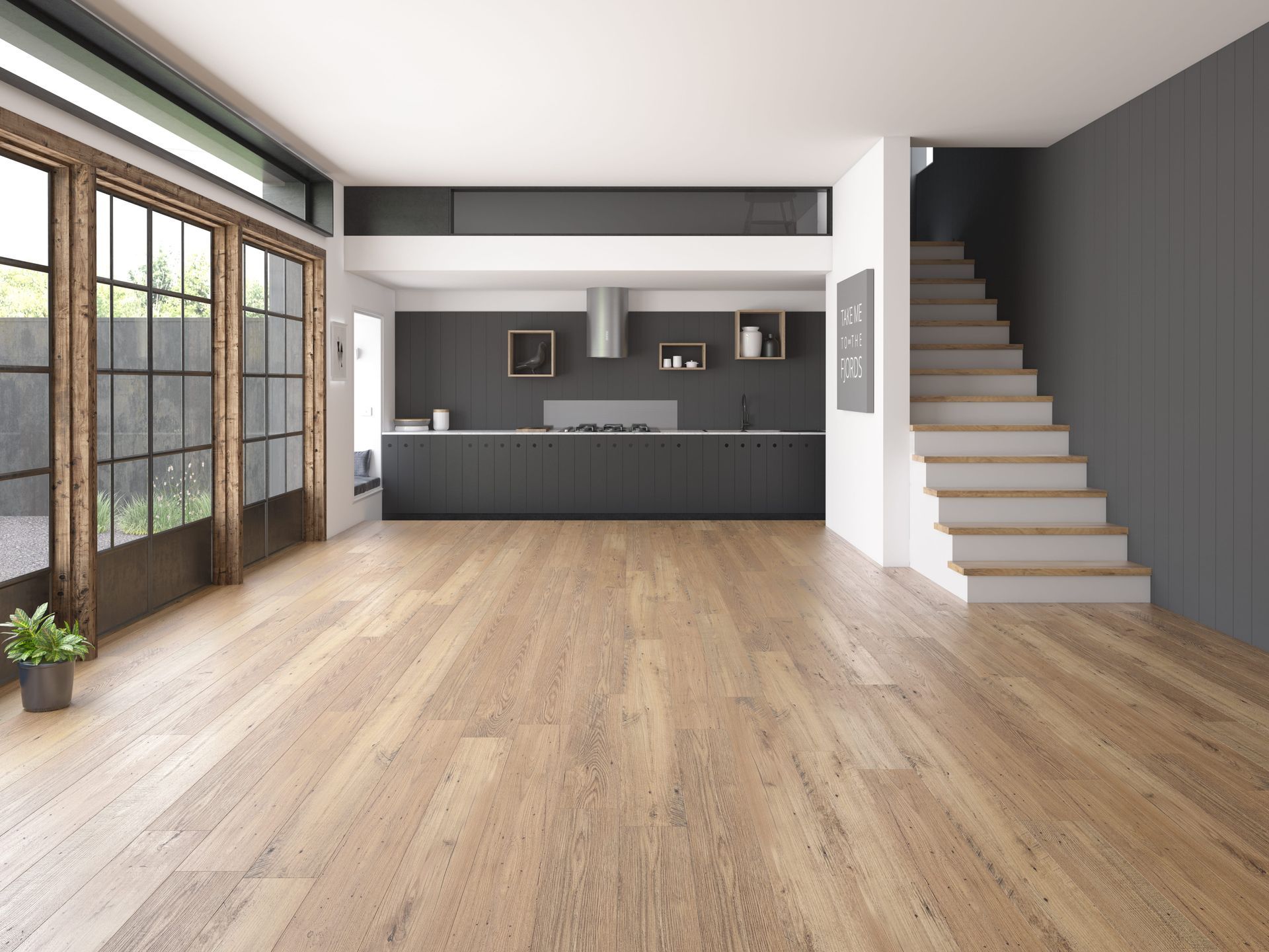 Bright modern open-plan living room with wood floors, dark kitchen, large windows, and stairs on the right
