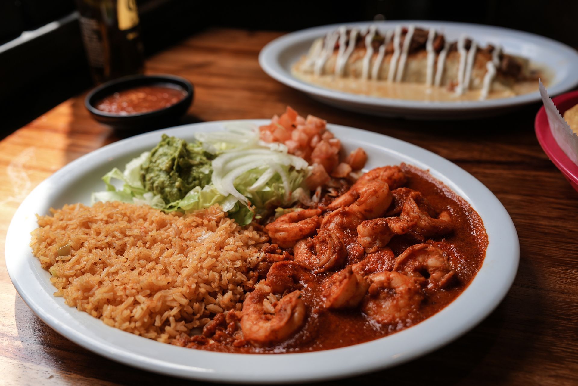 A plate of food with shrimp and rice on a table