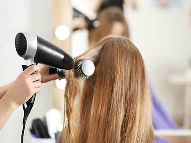 Stylist Blow-Drying Hair — Hair Salon in Sippy Downs, QLD Stylist Blow-Drying Hair — Hair Salon in Sippy Downs, QLD