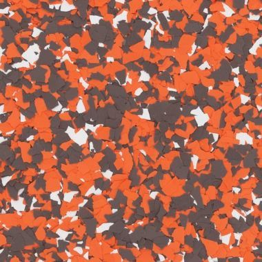 A close-up texture of decorative vinyl floor flakes in a mix of orange, dark brown, and white colors.