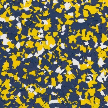 A pattern of multi-colored, jagged vinyl paint chips in navy blue, bright yellow, and white.