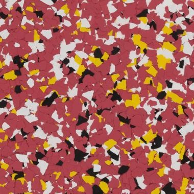 A textured surface featuring a mix of red, white, yellow, and black vinyl flakes or chips in a confetti-like pattern.
