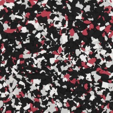 Decorative floor flake chips in a blend of black, white, gray, and deep red.