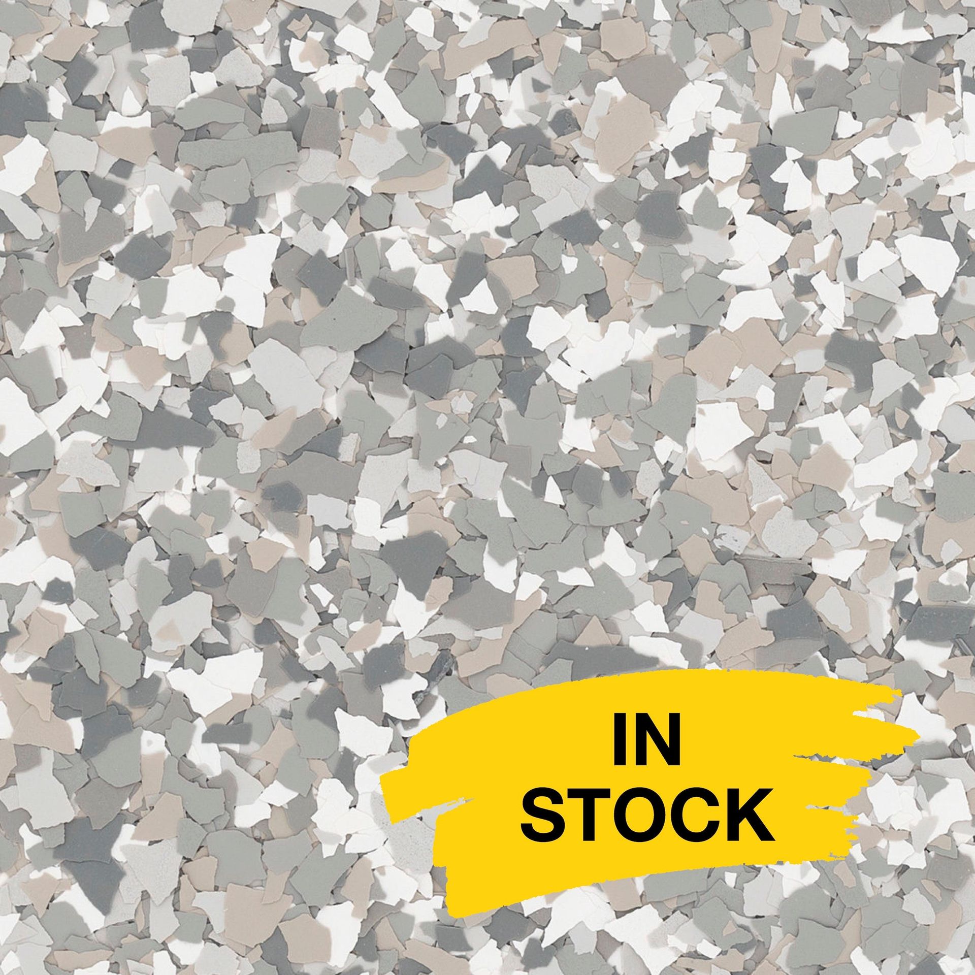 Gray, white, and tan decorative paint chips for epoxy flooring with a yellow 