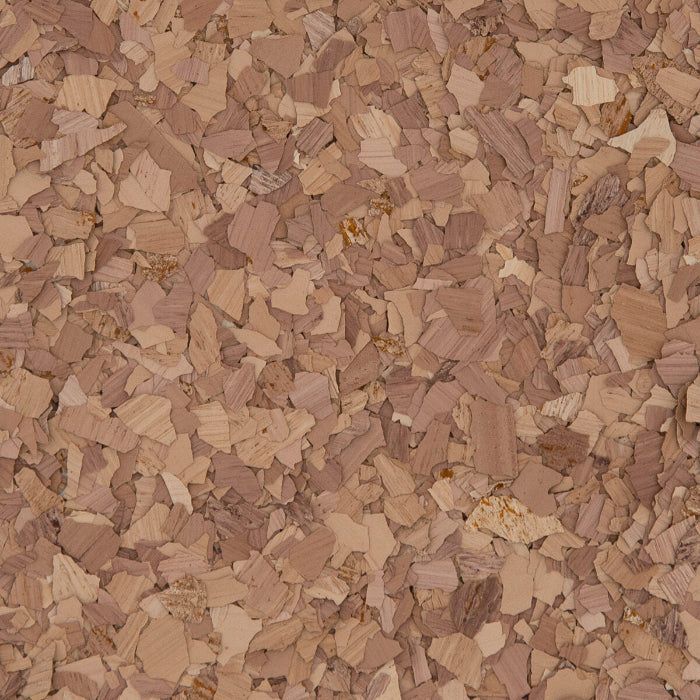 A close-up texture of light and medium-brown cork pieces compressed together.