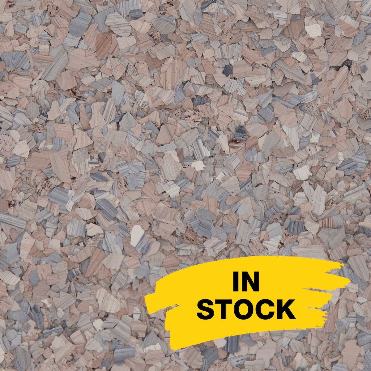 A close-up of textured cork flooring with pink and grey fragments, featuring a yellow 
