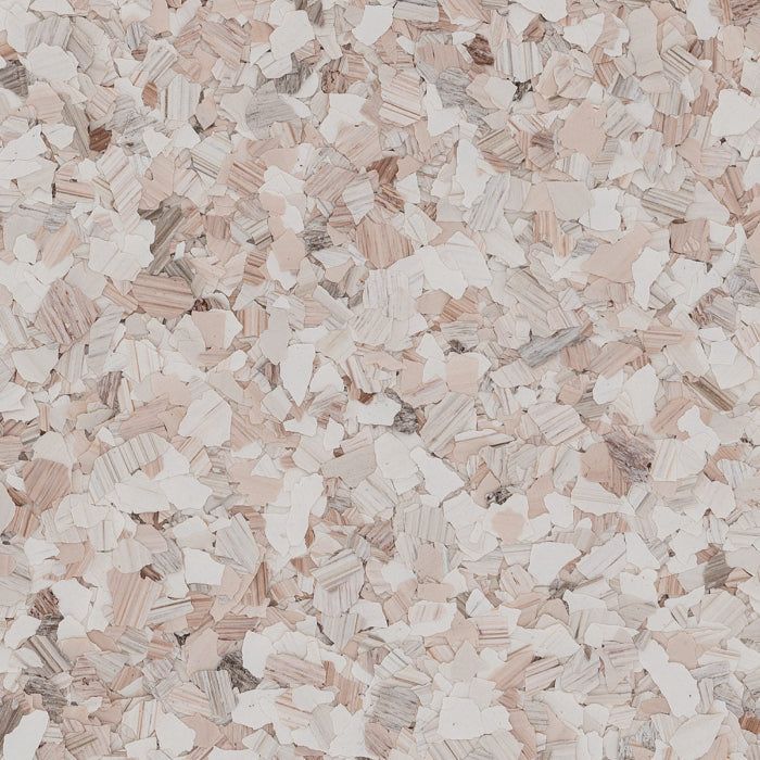 A textured surface of decorative vinyl chips in shades of cream, beige, light brown, and grey.