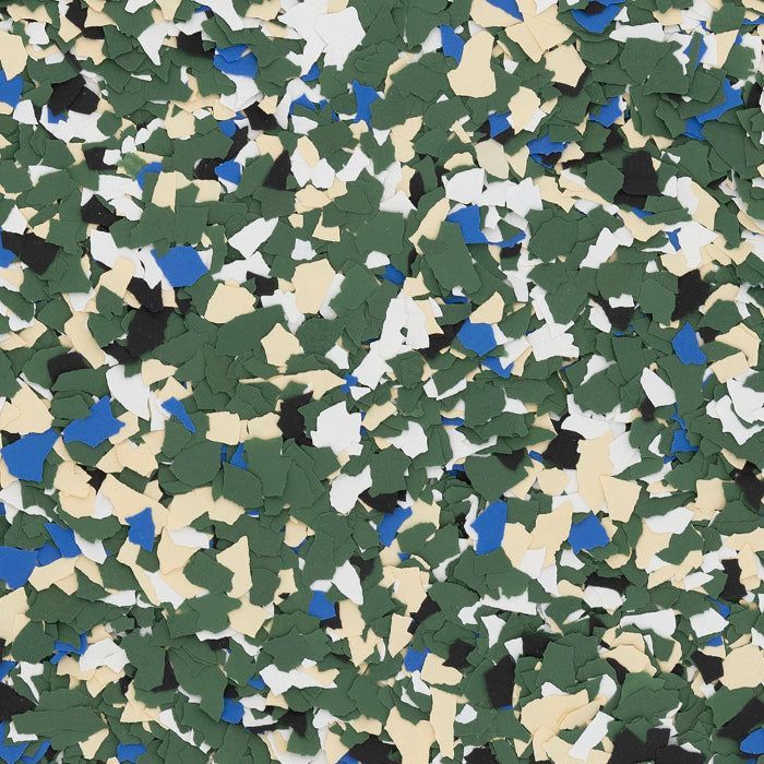 A colorful camouflage pattern composed of scattered, irregular flecks in shades of forest green, white, tan, blue, and black.