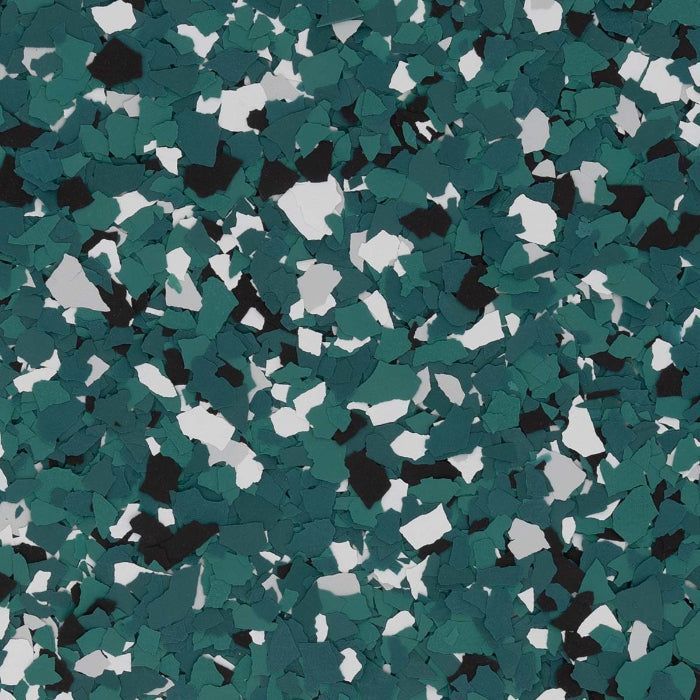 A pattern of speckled vinyl flooring chips in shades of teal, white, and black.