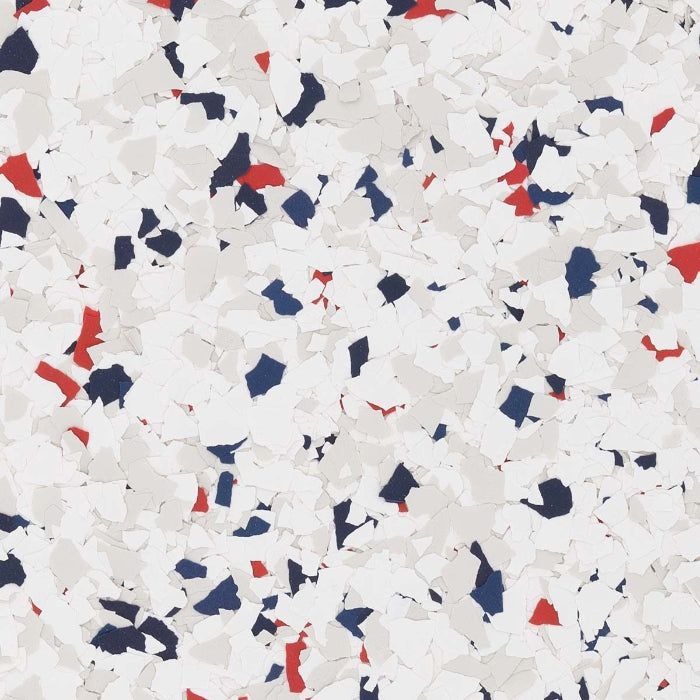 Decorative floor flake texture in white, light gray, dark blue, and red chips scattered across a neutral background.