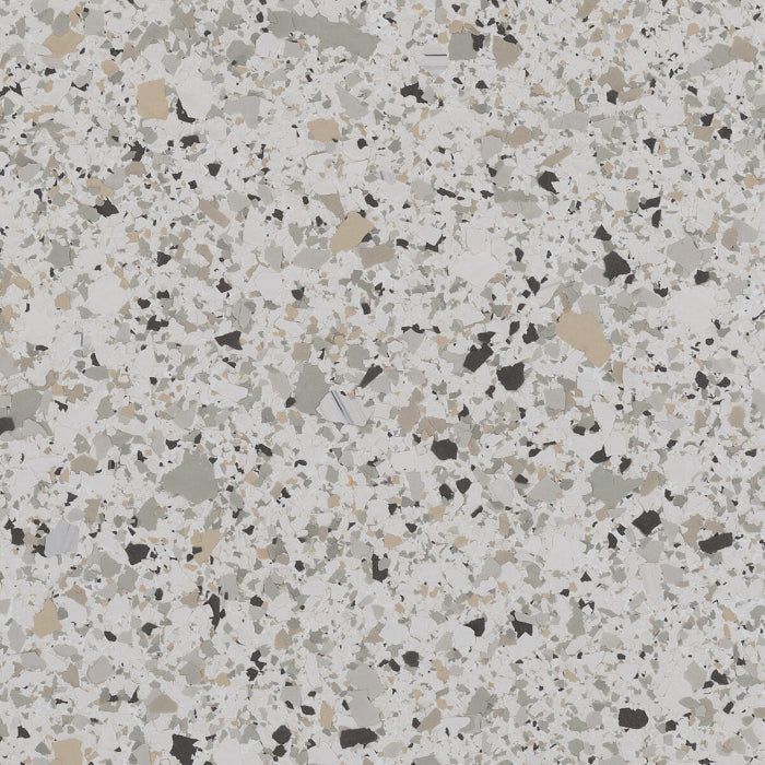 A close-up of a speckled floor texture featuring light gray, tan, charcoal, and white flecks on a light gray background.