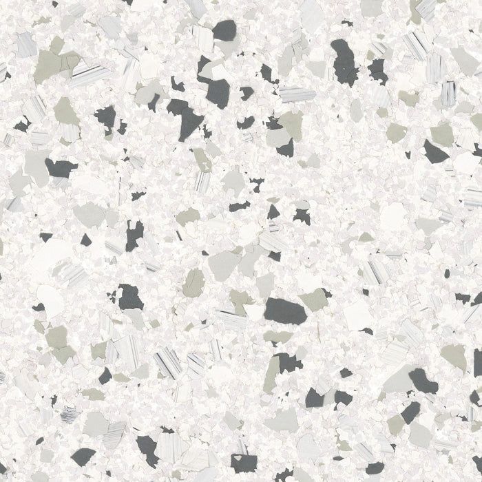A speckled pattern of dark grey, light grey, and white flecks on a textured white background, resembling terrazzo or quartz.
