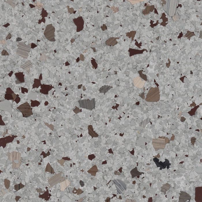 Gray flooring texture featuring a dense mix of light gray, dark brown, tan, and charcoal-colored flecks.