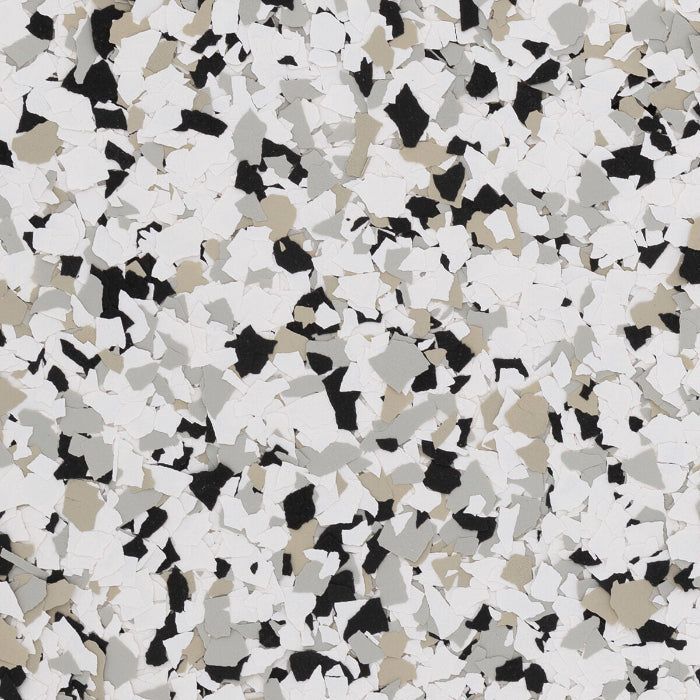 Decorative floor flake texture in a mix of white, black, gray, and tan, creating a speckled, multi-colored pattern.