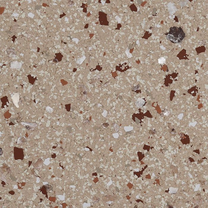 Close-up of beige granite-look flooring with speckled dark brown, white, and tan chip accents.