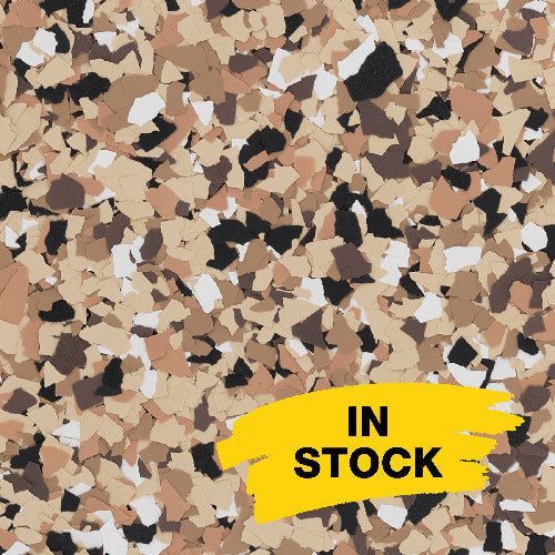 Tan, brown, black, and white decorative vinyl floor flakes with a yellow 
