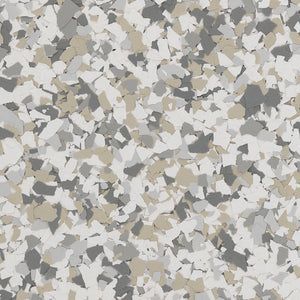 A close-up of vinyl paint flakes in shades of white, light gray, dark gray, and tan, typically used for floor coatings.