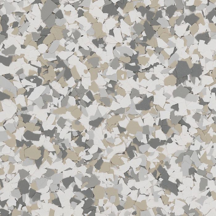 A mottled pattern of overlapping, angular flecks in shades of white, light gray, dark gray, and tan.