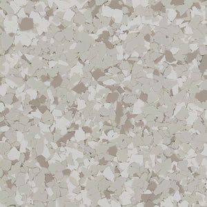 A close-up of a decorative epoxy floor coating with a speckled, multi-tone pattern of light gray, beige, and white flakes.