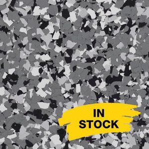 Gray, white, and black flecked epoxy floor coating material with a yellow 