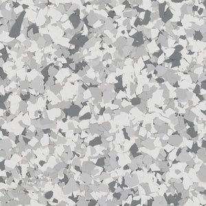 Decorative epoxy floor coating with a speckled pattern of white, light gray, and dark gray flakes.