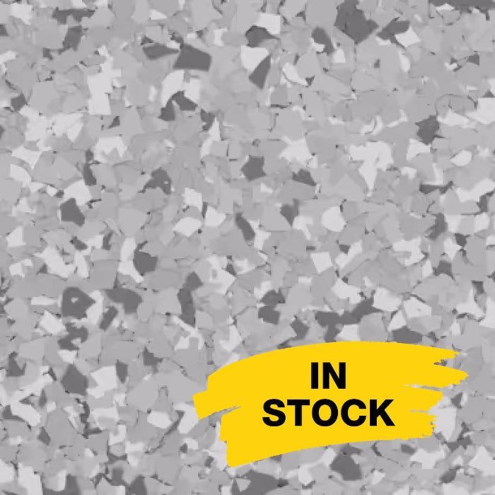 Grey, black, and white decorative vinyl floor flakes with a yellow banner in the corner reading 