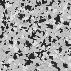 A flooring pattern featuring a dense, random mix of black, light gray, and white vinyl chips.