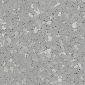 A seamless, speckled pattern featuring a mix of light, medium, and dark gray irregular shapes.