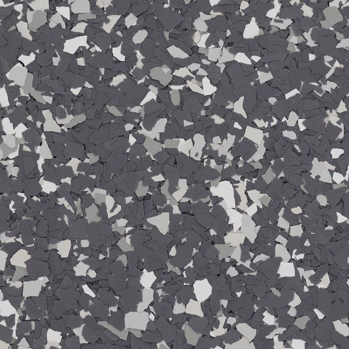 A speckled floor coating texture featuring a mix of dark charcoal, medium grey, and light grey vinyl chips.