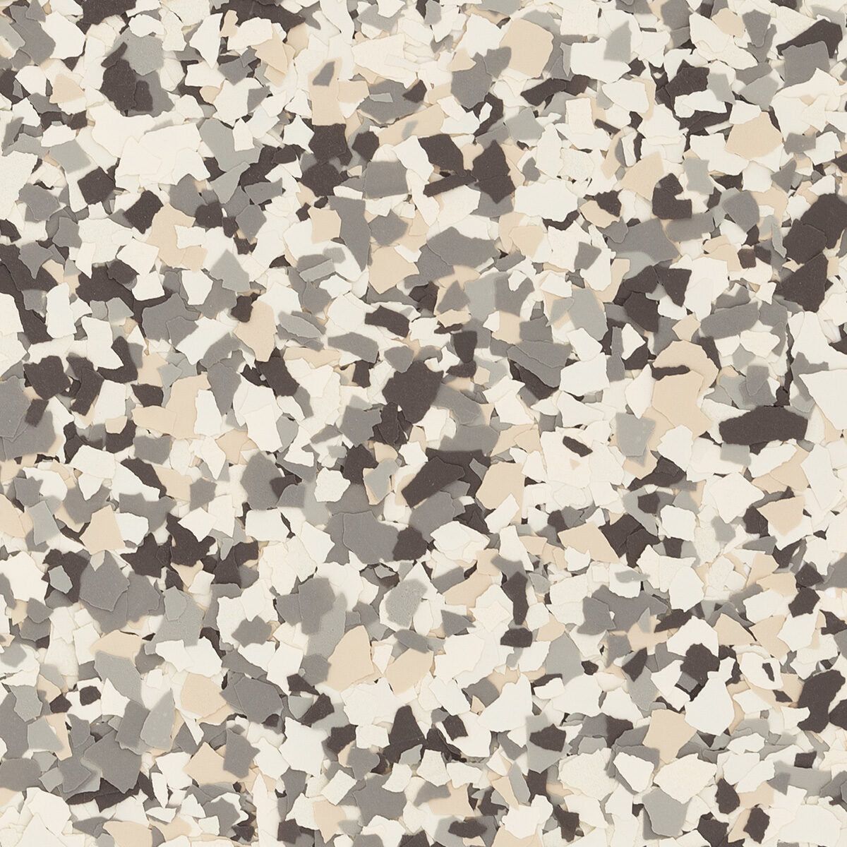 A multi-colored floor texture made of small, irregularly shaped tan, grey, dark brown, and off-white flakes.