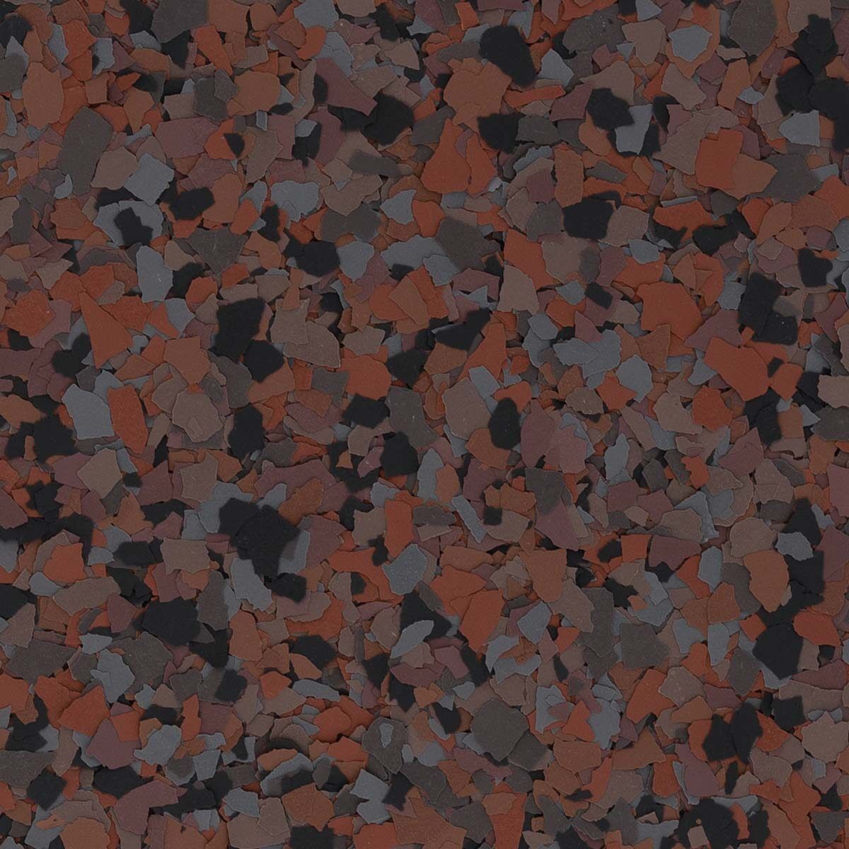 A textured floor coating material composed of small, irregular flakes in shades of reddish-brown, charcoal gray, and black.