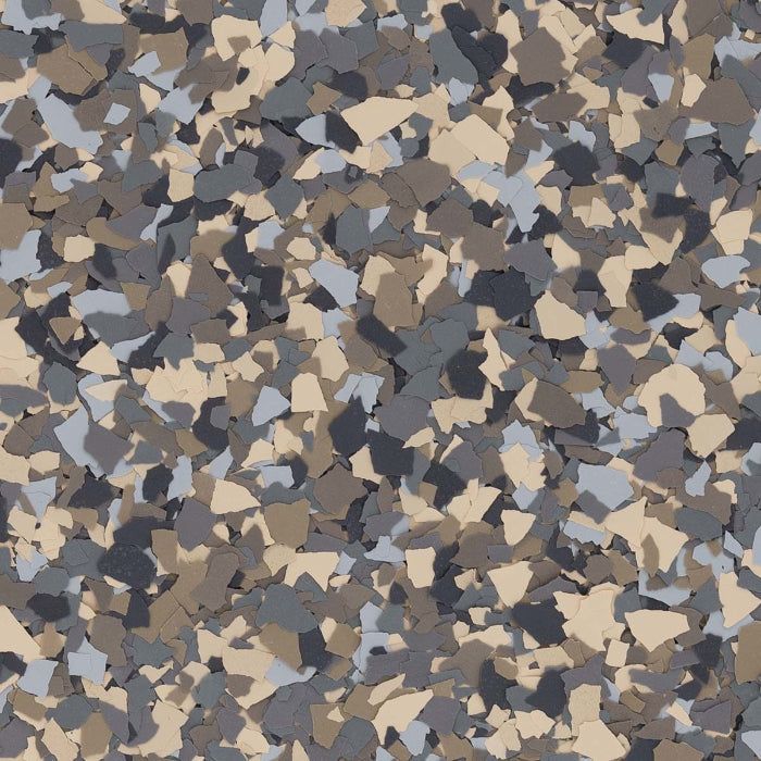 A pattern of small, irregularly shaped flecks in shades of beige, light gray, dark gray, and charcoal.