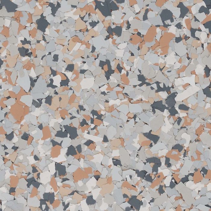 A surface texture featuring a speckled mix of gray, white, beige, and dark charcoal vinyl paint chips.