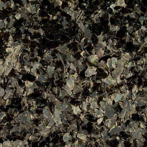 A close-up texture of dark, shimmering mica flakes in shades of black, charcoal, and metallic bronze.