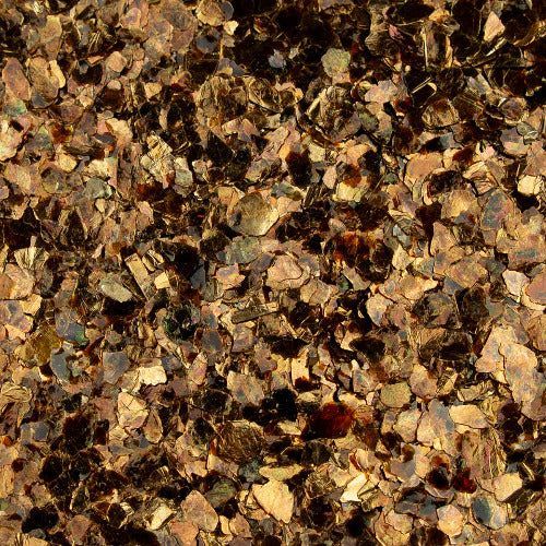 A dense, textured pattern of small, irregularly shaped bronze and dark brown metallic flakes.