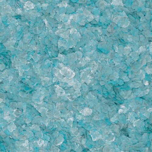 A close-up of coarse, translucent light blue and clear salt or sugar crystals.