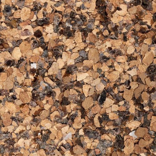 A close-up of a textured surface composed of small, irregular tan and dark brown cork or stone fragments.