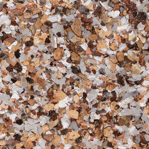A mixture of decorative paint chips in shades of tan, brown, black, and white for flooring or surface application.