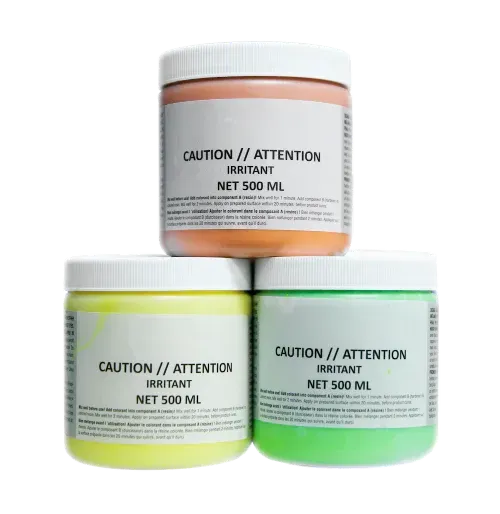 Three 500ml jars of orange, yellow, and green paint stacked in a pyramid, each labeled with a caution warning.