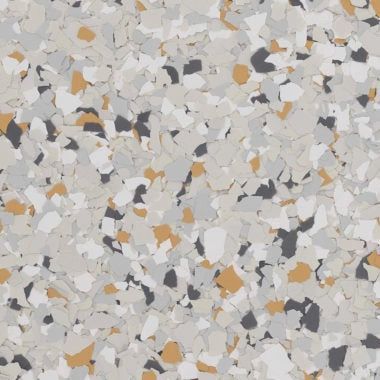 Decorative epoxy floor coating with a speckled texture of white, gray, charcoal, and tan chips.