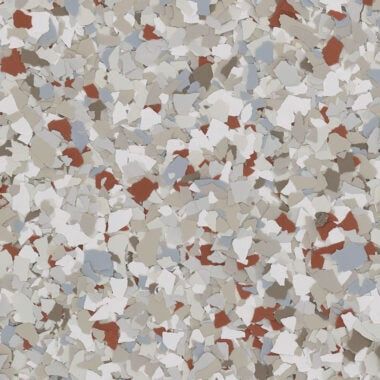 A multi-colored floor flake texture featuring a mix of white, light gray, tan, and reddish-brown chips.