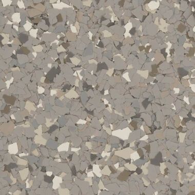 A close-up of a decorative flooring pattern featuring a dense mix of gray, beige, and cream-colored vinyl flakes.