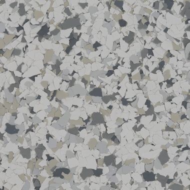 A close-up of light gray epoxy flooring with decorative vinyl paint chips in shades of gray, white, and tan.
