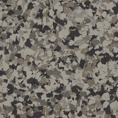 A close-up of a decorative epoxy floor coating featuring a dense, multi-colored pattern of gray, beige, and black flakes.