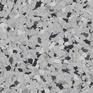 A textured floor coating featuring a speckled pattern of black, gray, and white vinyl chips.