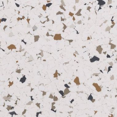 Decorative vinyl flooring flakes in a mix of white, tan, brown, and charcoal gray, creating a speckled, textured pattern.