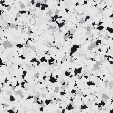 A decorative floor flake texture featuring a dense mix of white, grey, and black chips.